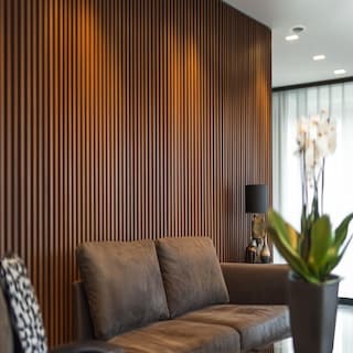 Modern Living Room Wall Design With Brown Wooden Fluted Panels