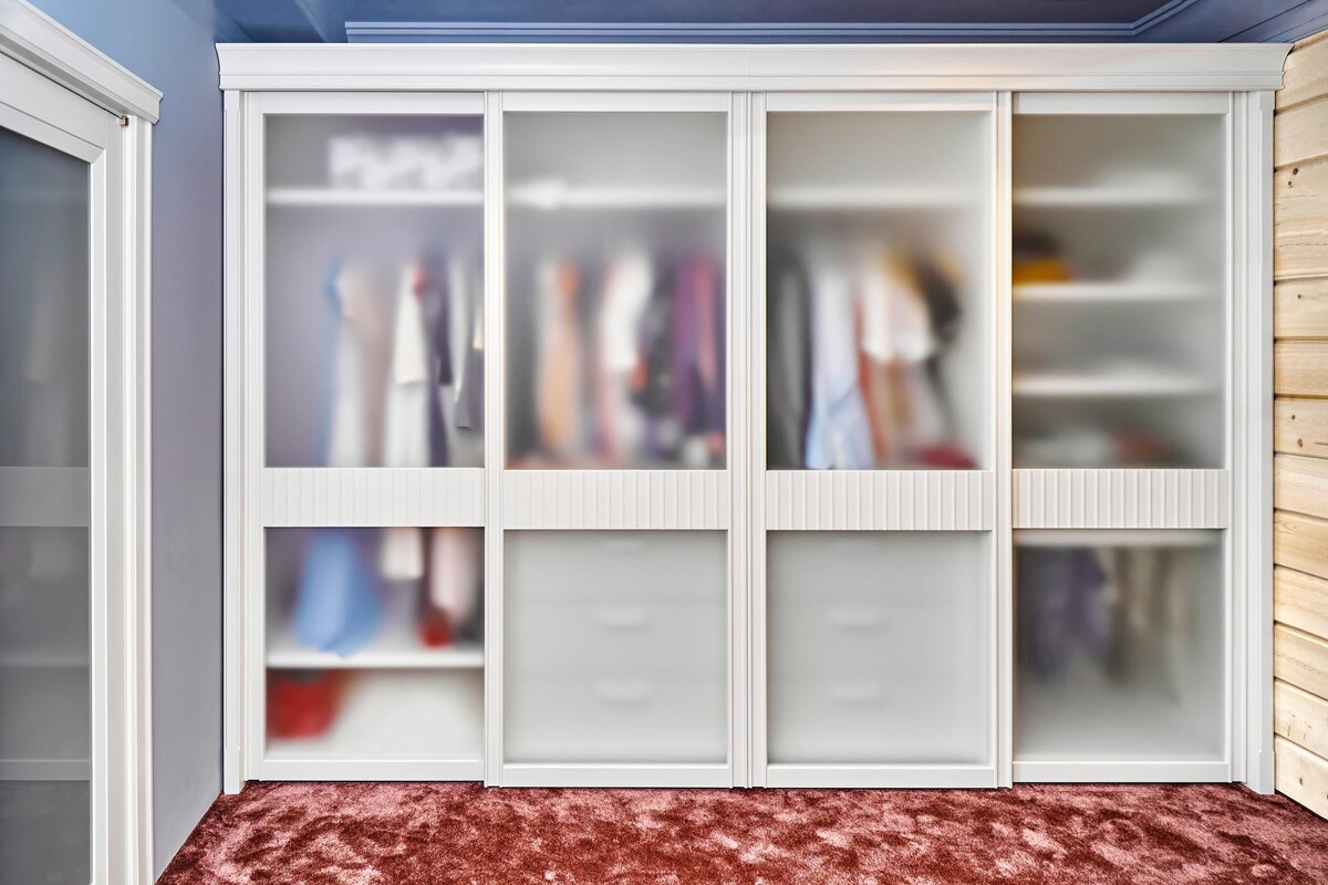 Contemporary Wardrobe Design with Lacquered Glass Shutters Contemporary Wardrobe Design with Lacquered Glass Shutters