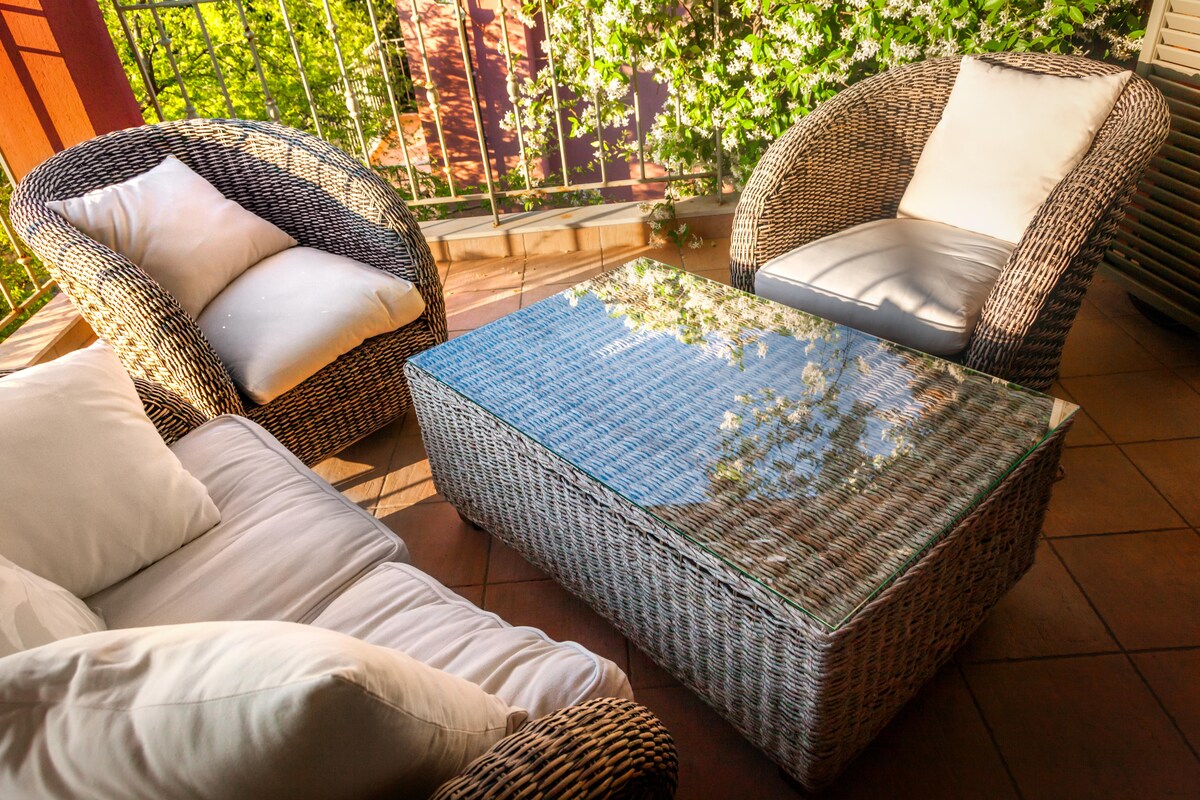 Cosy Contemporary Balcony Design with Wicker Furniture