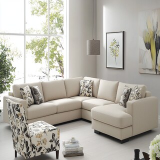 Contemporary Beige Living Room Design With L-Shaped Sofa And White Floral Accent Chair