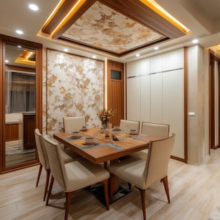 Modern Dining Room False Ceiling Design With Multicoloured Wallpaper And Wooden Border