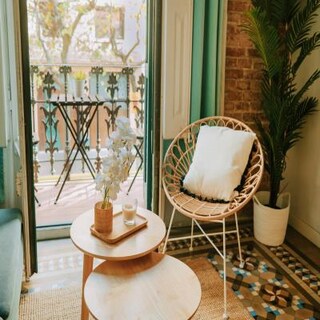 Cosy Modern Balcony Design with Wooden Tables and Chairs