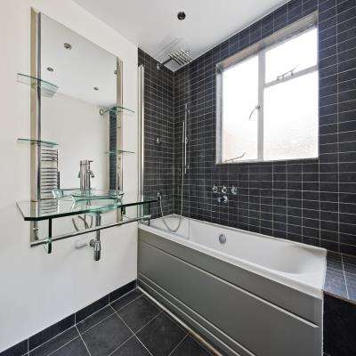 Open Bathroom Design with Glass Shelves for Storage