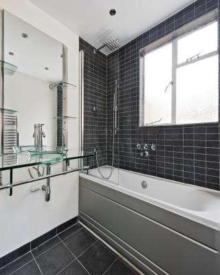 Open Bathroom Design with Glass Shelves for Storage