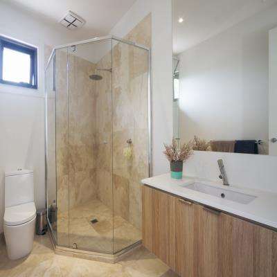 Corner Shower Bathroom Design with Marble Tiles