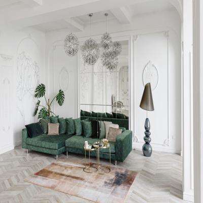 Luxurious Living Room Design Featuring Emerald Green Sofa and Artistic Lighting