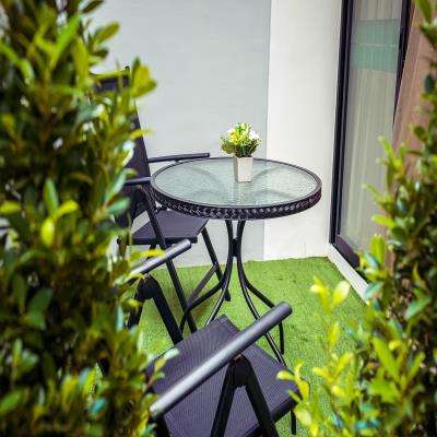 Elegant Modern Balcony Design with a Steel table and Chairs