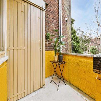 Simple Vibrant Yellow Balcony Design
