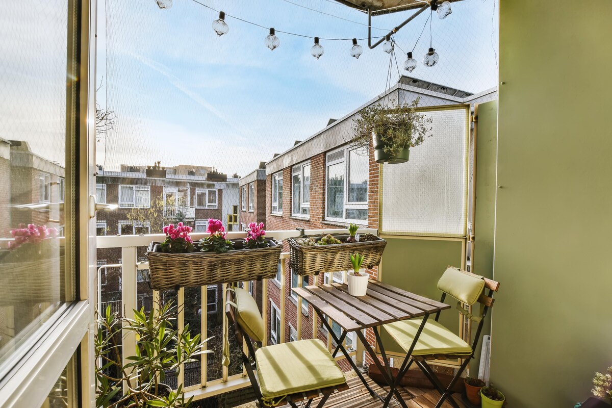 Cosy Contemporary Balcony Design with Wooden Tables and Chairs