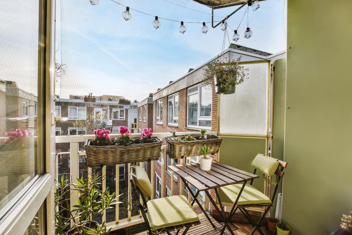 Cosy Contemporary Balcony Design with Wooden Tables and Chairs Cosy Contemporary Balcony Design with Wooden Tables and Chairs