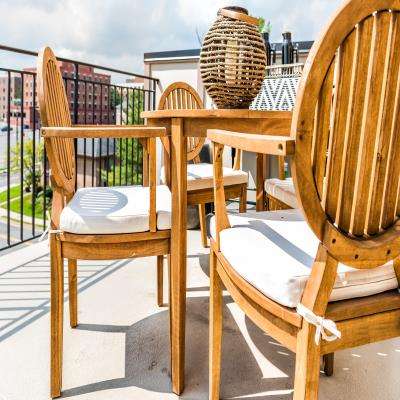 Simple Balcony Design with Wooden Table and Chairs