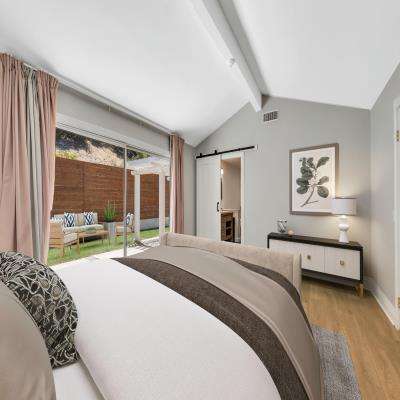 Elegant Contemporary Master Bedroom Design with a Balcony