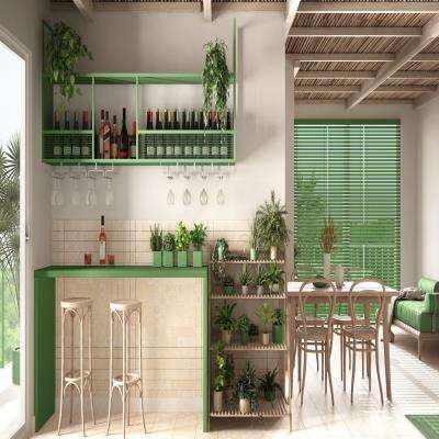 Green Living Room Design Featuring Minibar and Plentiful Greenery