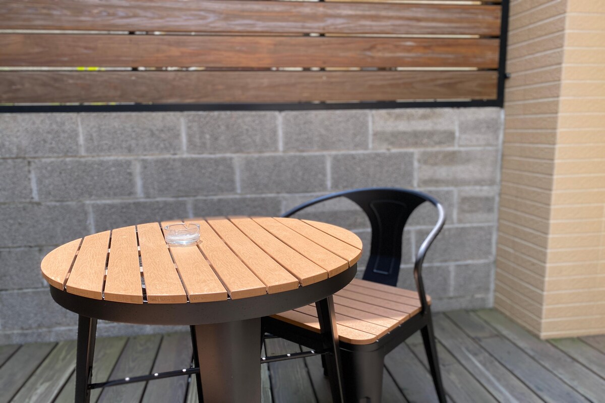 Elegant Contemporary Balcony Design with a Steel Table and Chair Elegant Contemporary Balcony Design with a Steel Table and Chair