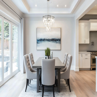 Contemporary 5-Seater White Dining Room Design With Grey Upholstered Chairs