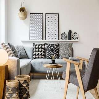 Patterened Black and White Focal Items in A simple Toned Living Room Design