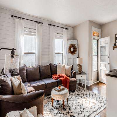 Scandinavian Living Room Design Featuring Black and Orange Elements