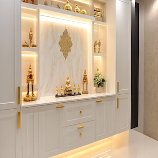 Modern White Pooja Room Design with Golden Handles