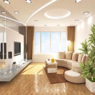 A Stylish Living Room Design With Modern Fall Ceiling And Curved Sofa