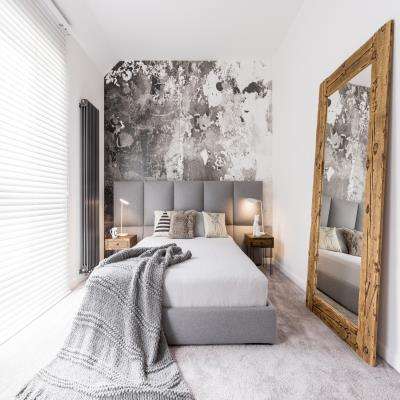 Abstract Master Bedroom Design with a Grey Headboard