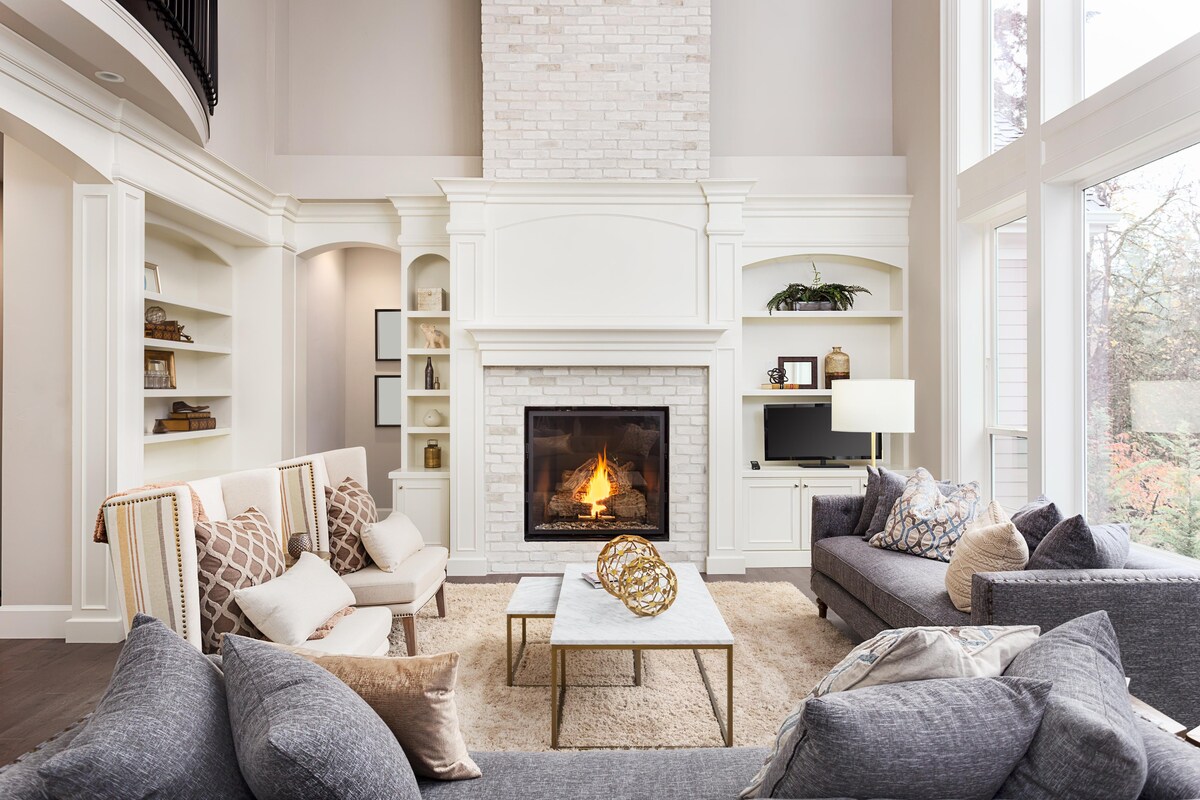 Luxurious Living Room Design With Comfortable Seating and Large Windows With Outside View Luxurious Living Room Design With Comfortable Seating and Large Windows With Outside View
