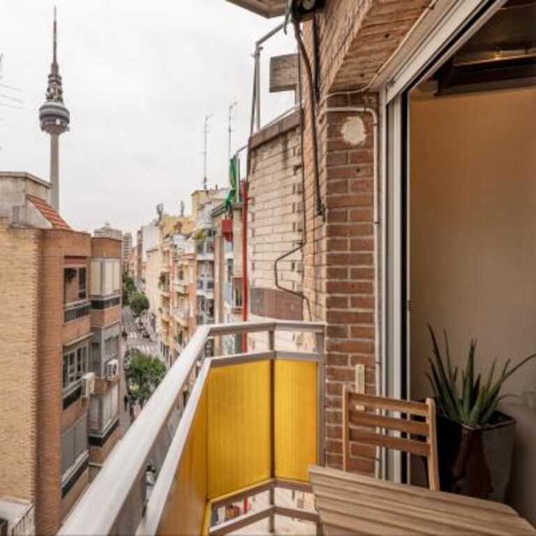 Simple Contemporary Balcony Design with Wooden Table and Chairs