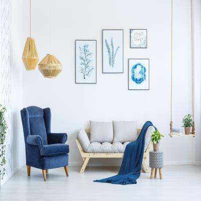 Sophisticated Living Room Design With A Velvety Persian Blue Accent Chair