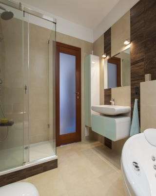Stylish Bathroom Design with Ambient Lighting and Creative Doors