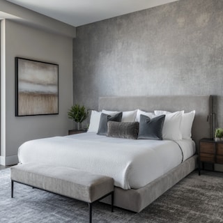 Modern Master Bedroom Design With King Bed and Grey Textured Wallpaper