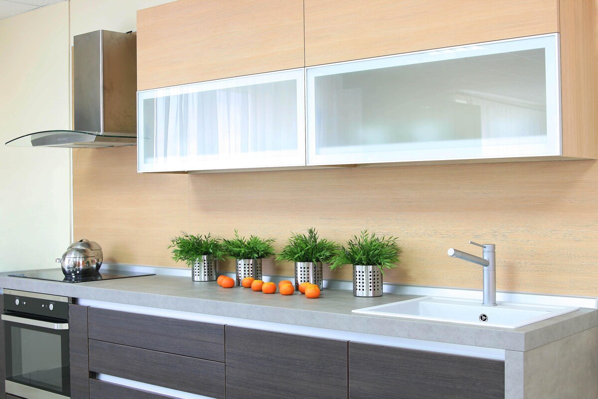 Glass Modular Kitchen with Rustic Finishes Glass Modular Kitchen with Rustic Finishes