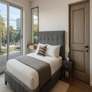 Neutral Bedroom with Upholstered Bed and Wooden Details