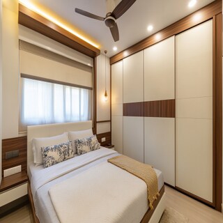 Modern Sliding Door Wardrobe Design In White And Wood For Bedrooms