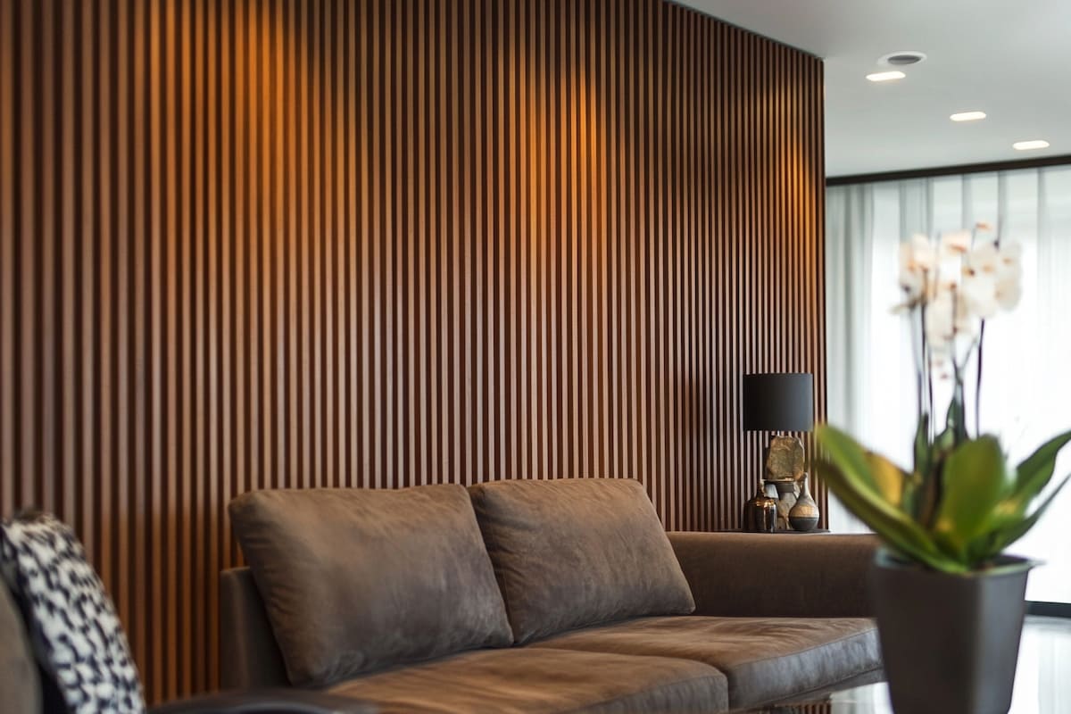 Modern Living Room Wall Design With Brown Wooden Fluted Panels