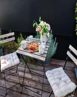 Simple Rustic Balcony Design with White Chairs
