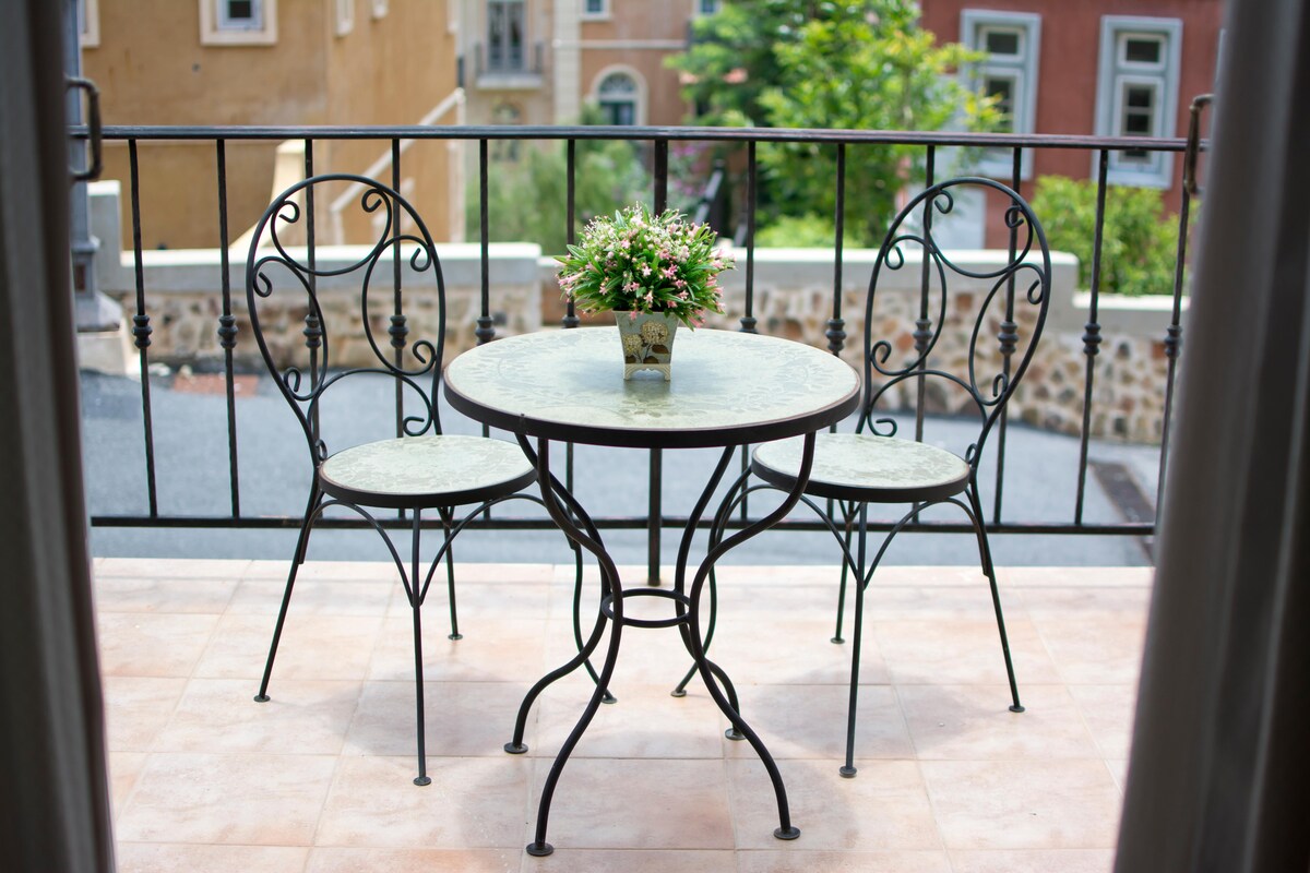 Simple Rustic Balcony Design with a Steel Table and Chairs Simple Rustic Balcony Design with a Steel Table and Chairs