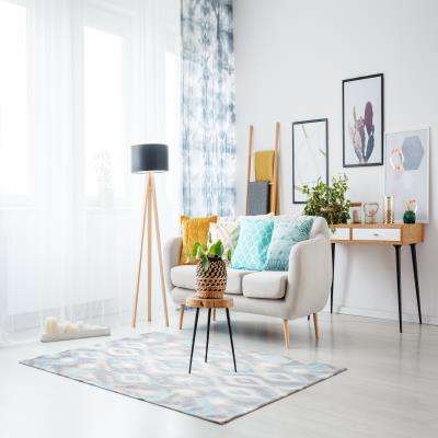 Ambient Living Room Design With Ample Sunlight and Tie Dye Curtains