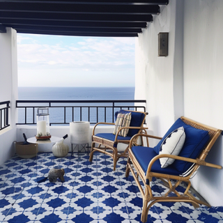 Coastal Balcony Design With Blue And Grey Moroccan-Patterned Flooring