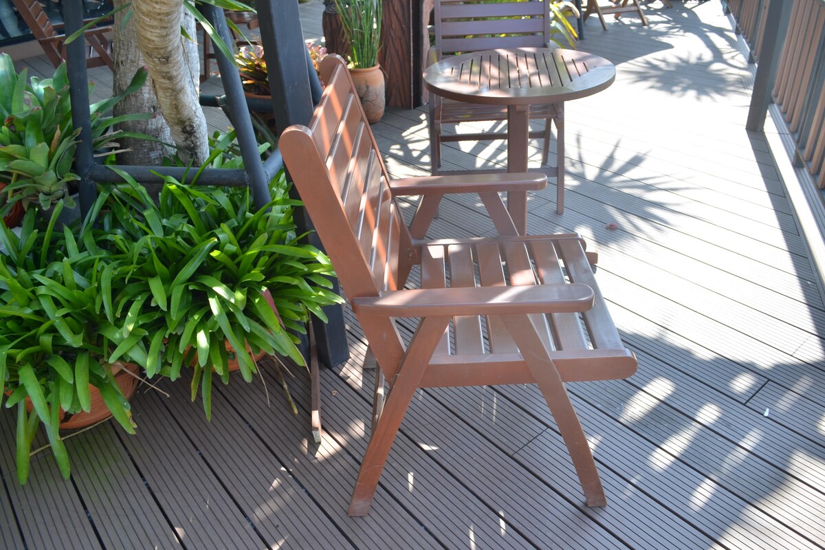 Simple Rustic Balcony Design with Arm Chairs