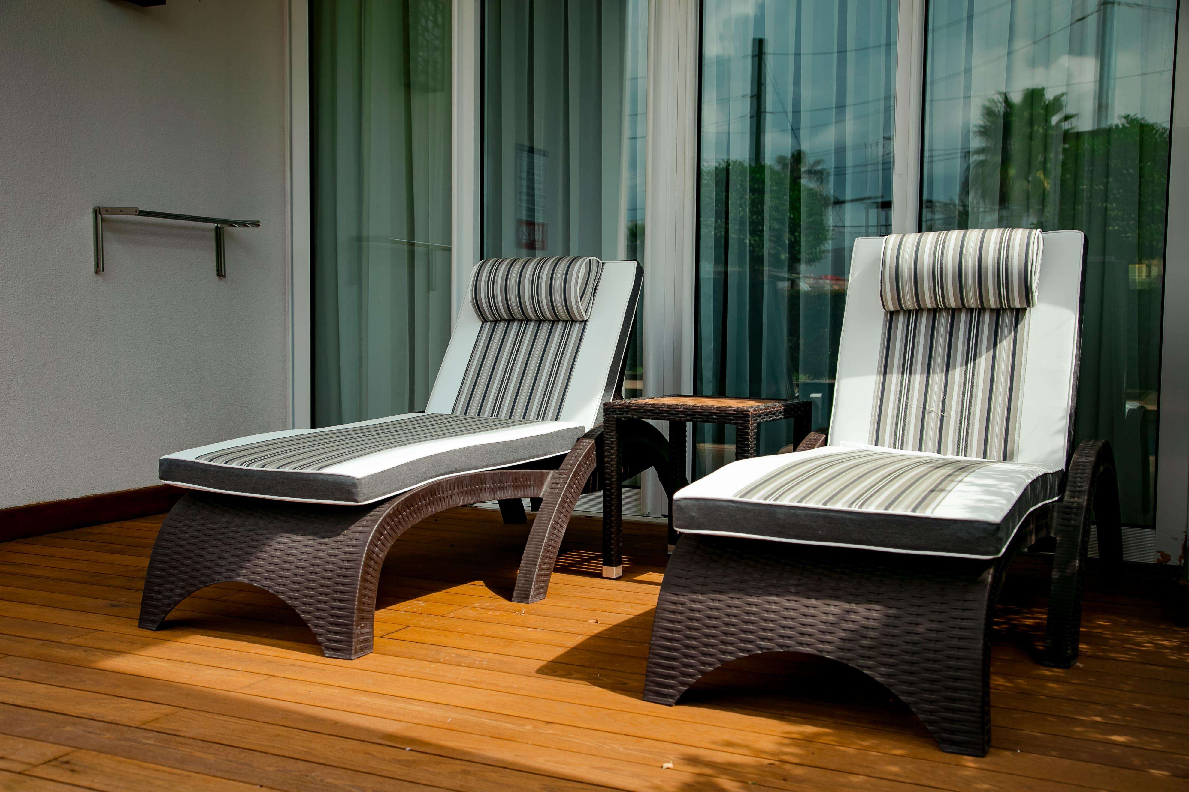 Cosy Contemporary Balcony Design with Chaise Lounge Sofa