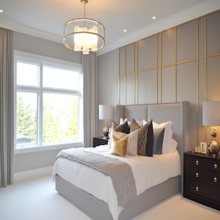 Modern Master Bedroom Design With Textured Grey Panels And Gold Stripes