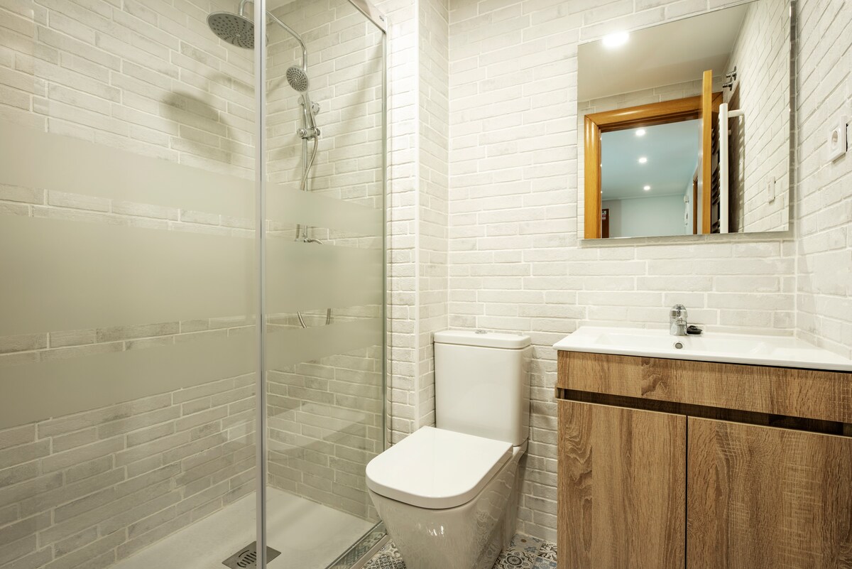 Sleek Bathroom Design with Glass Partition for Small Spaces