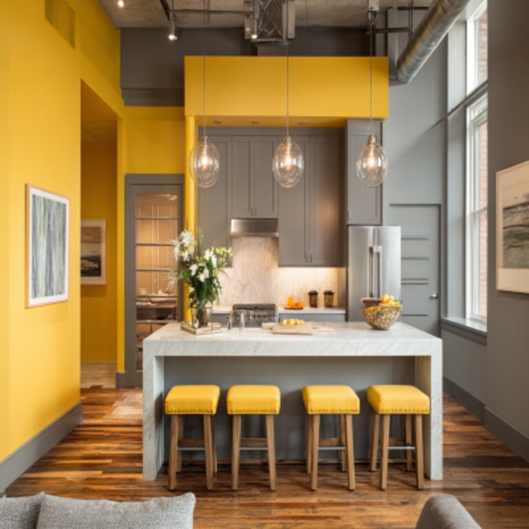 Calm Yellow and Grey Wall Colour Combination for Kitchen with Industrial Lights and Island Seating