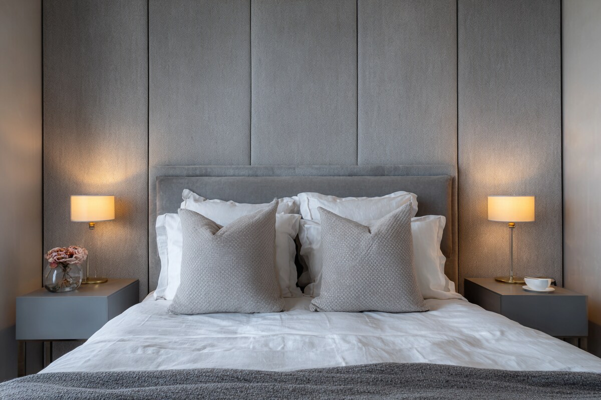 Contemporary Bedroom Design With A Double Bed And Grey Side Tables Contemporary Bedroom Design With A Double Bed And Grey Side Tables