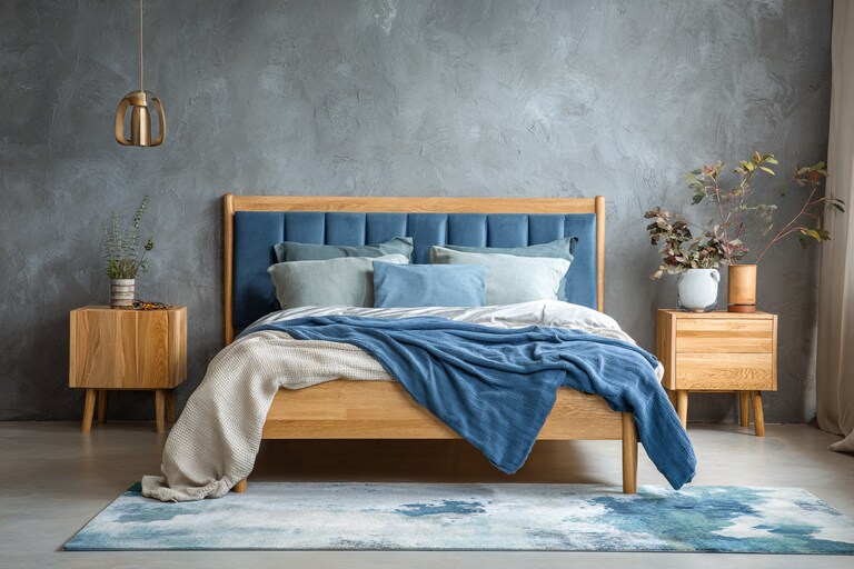 Contemporary Bedroom Design With A Wooden Bed And A Blue Vertical Headboard