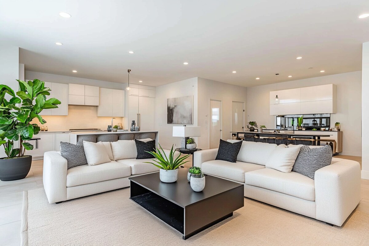 Contemporary Living Room Design with White Sofas and Black Coffee Table