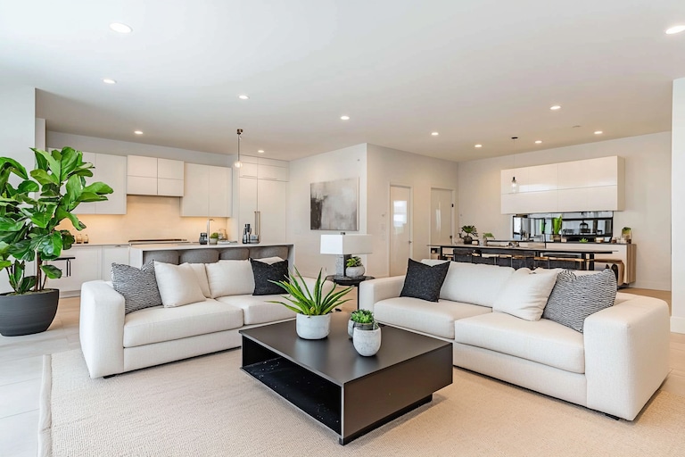 Contemporary Living Room Design with White Sofas and Black Coffee Table