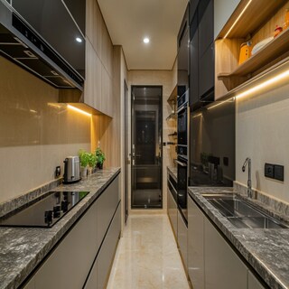 Contemporary Parallel Kitchen Design With Granite Countertop and Open Shelf