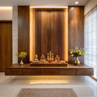 Contemporary Pooja Room Design With Wooden Reapers And Storage Unit
