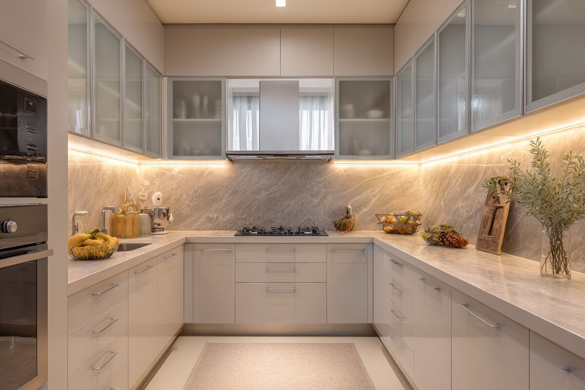 Contemporary U-Shaped Kitchen Design with Under-Cabinet Lighting Glass Cabinets and Marble Backsplash Contemporary U-Shaped Kitchen Design with Under-Cabinet Lighting Glass Cabinets and Marble Backsplash