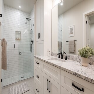 Contemporary White Bathroom Design With A Granite Countertop